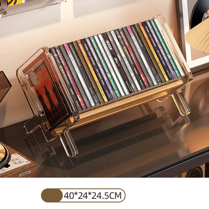 CD holder with transparent cover holding CDs on a desk