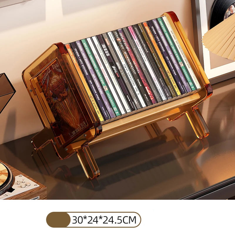 CD holder with colorful CD cases on a reflective surface