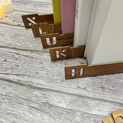 Wooden bookends with letter 'U' on a wooden surface